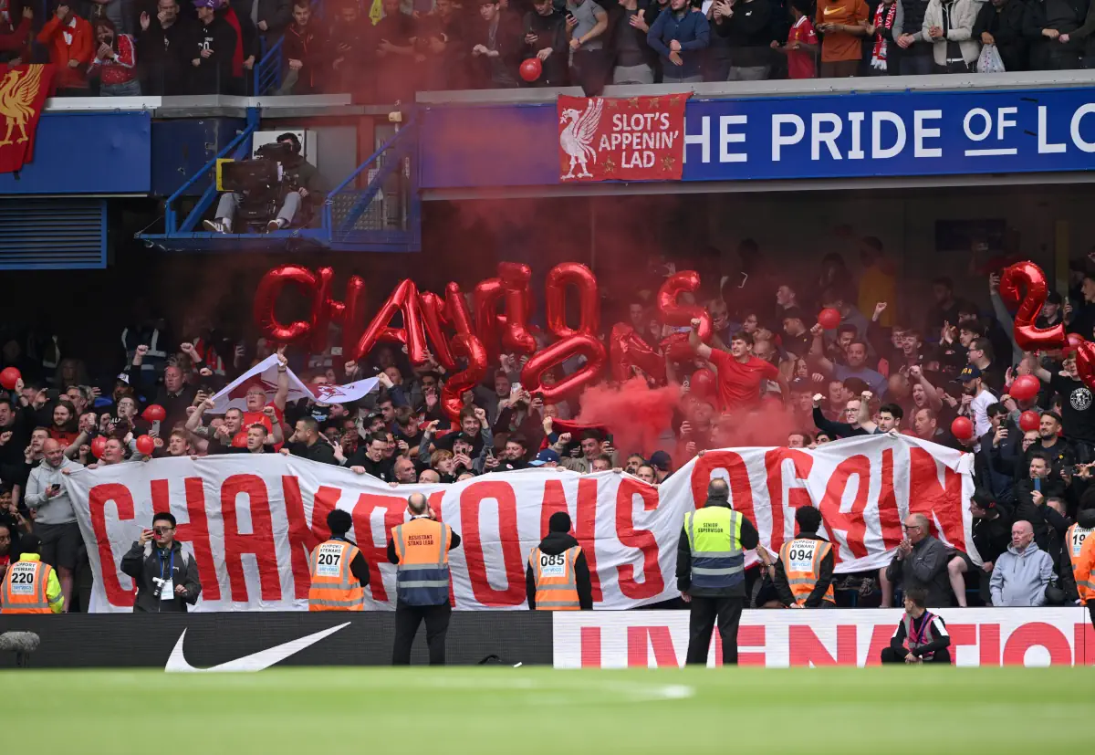Liverpool fans celebrate having won the title