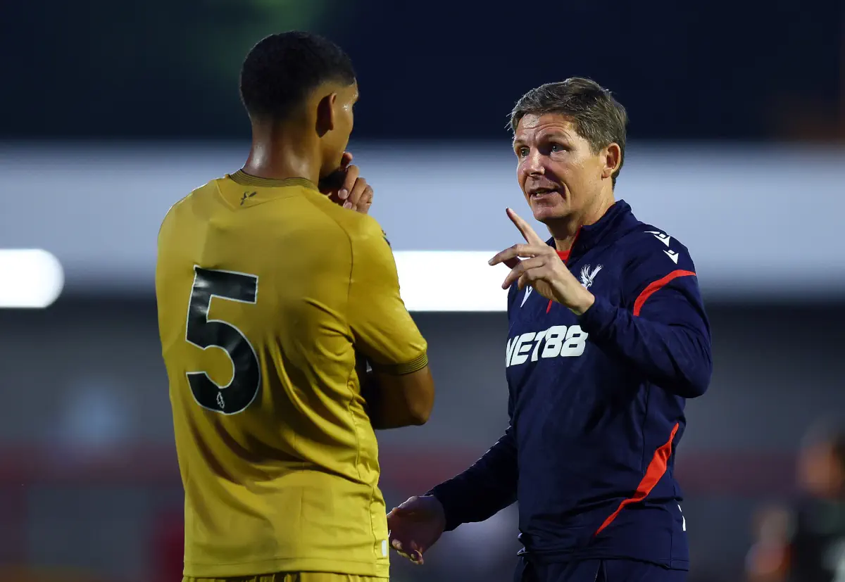 Crystal Palace manager Oliver Glasner delivers instructions to Maxence Lacroix after a game