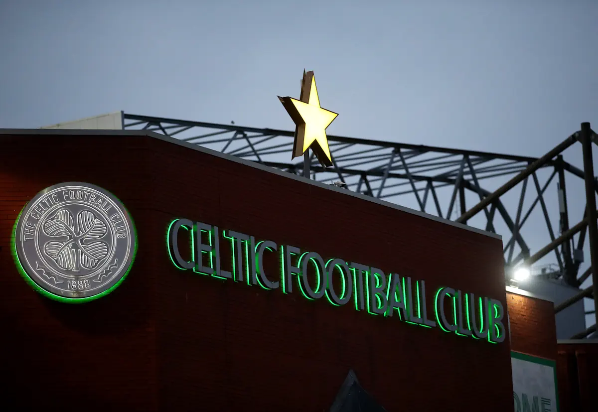 Celtic Football Club seen written on the side of Celtic Park, with the club's badge and a single star
